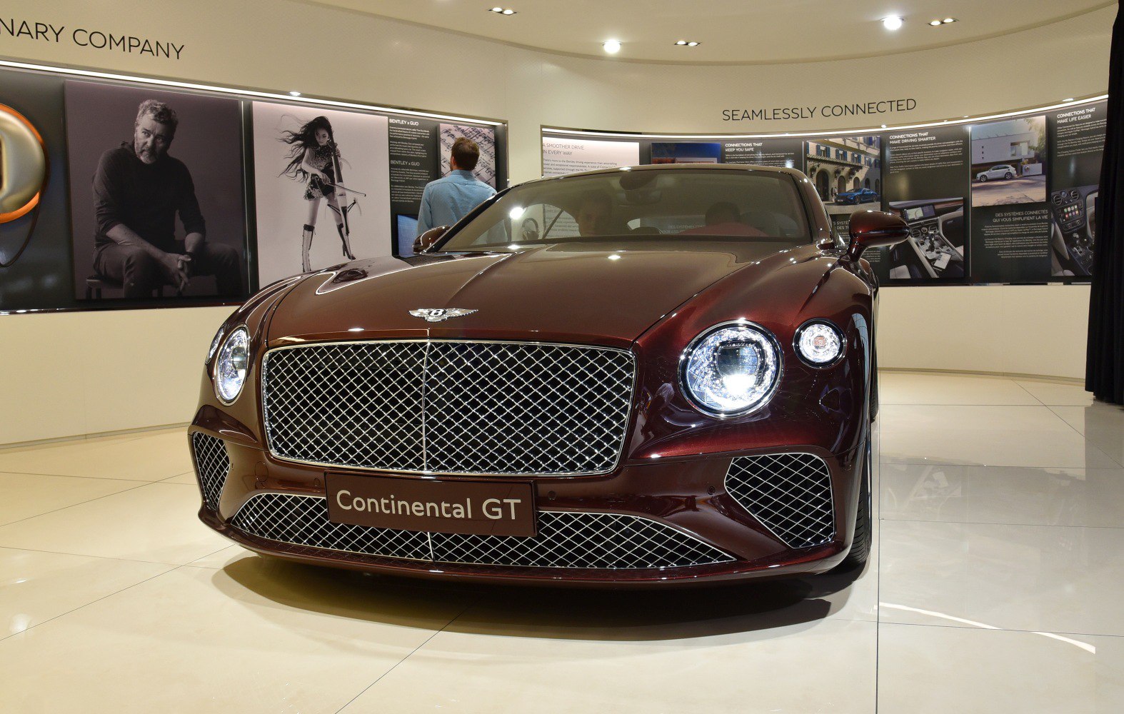 Luxury sedan front with mesh grille and round headlights