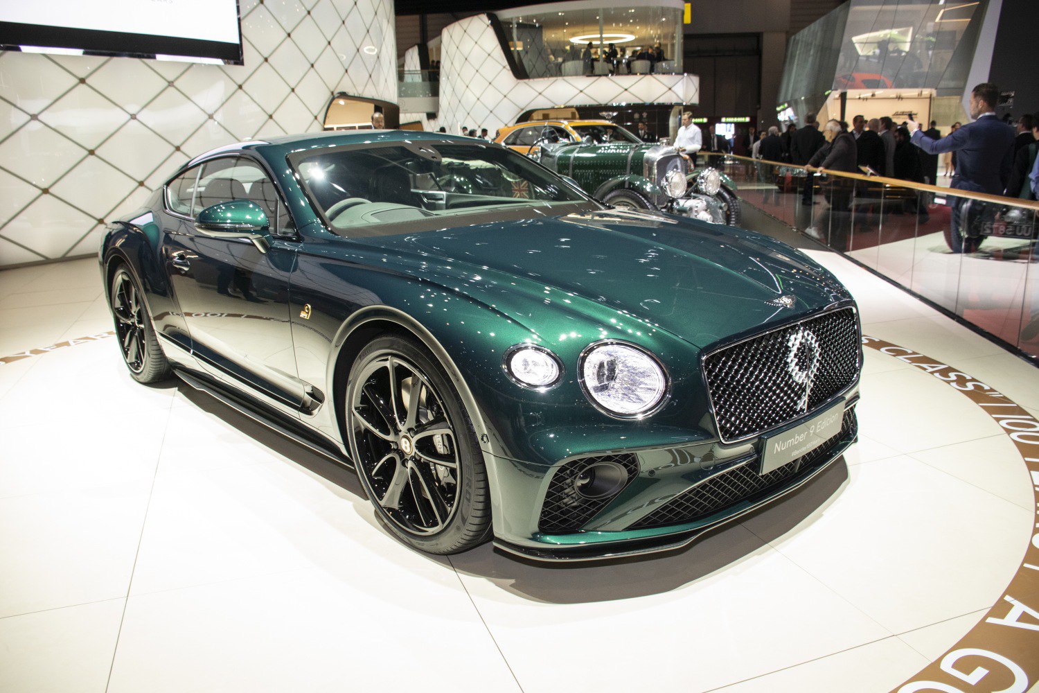 Luxury coupe with dual round headlights and mesh grille