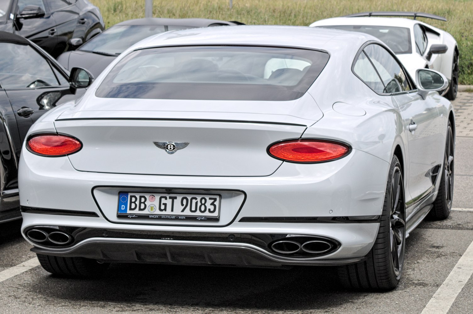 Rear view with oval taillights and quad exhaust pipes
