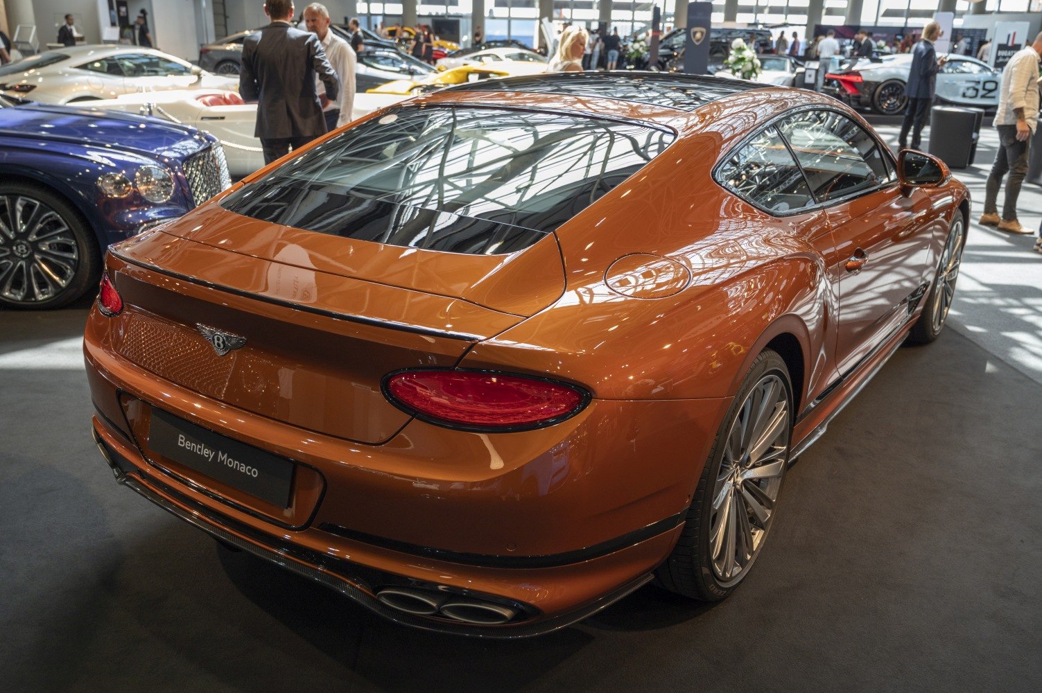 Sleek rear design and quad exhaust setup in a luxury coupe