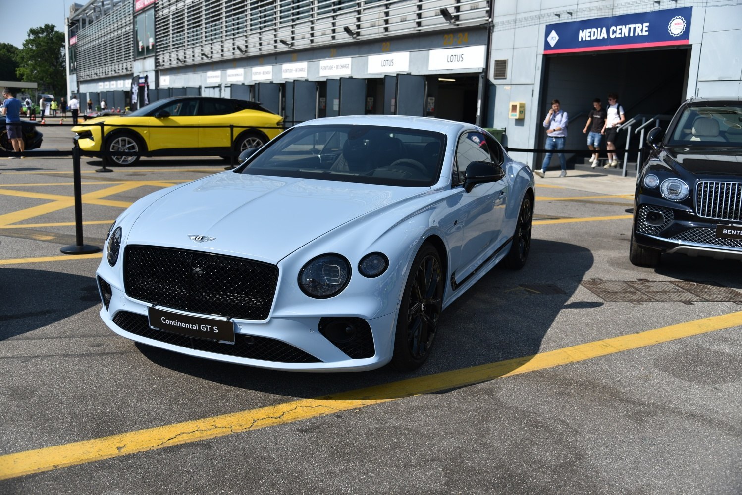 Luxury sports coupe front with round headlights and black mesh grille