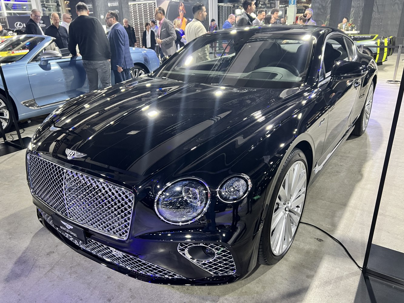 Luxury coupe with mesh grille and circular headlights