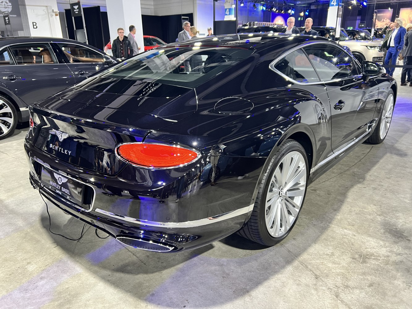 Rear side view with distinct taillights and large alloy wheels