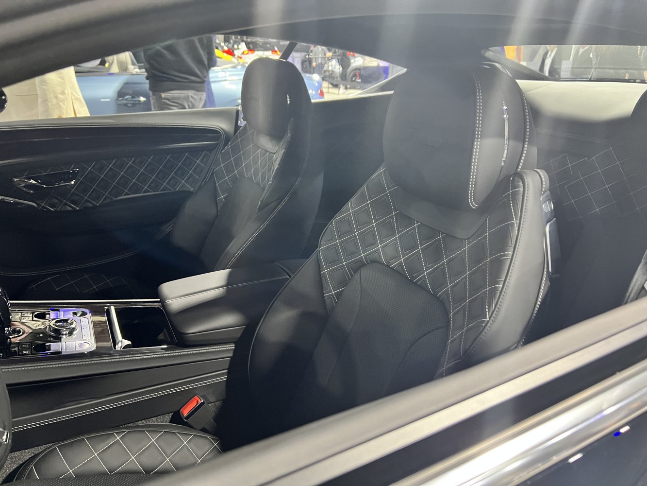 Quilted leather bucket seats and luxury car interior details