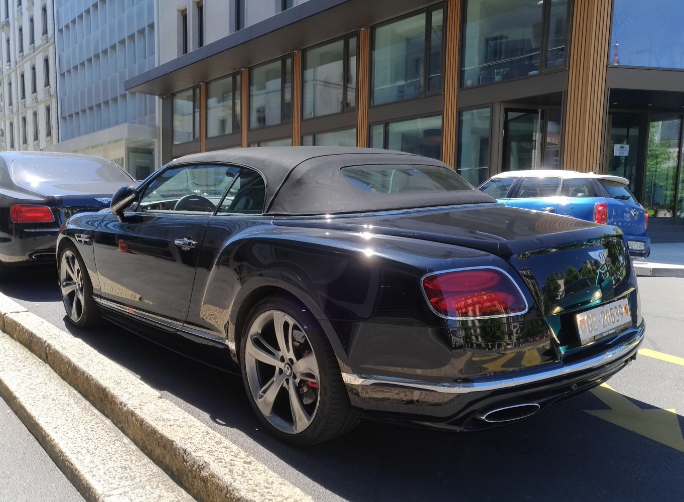Black soft top convertible rear with alloy wheels and taillights