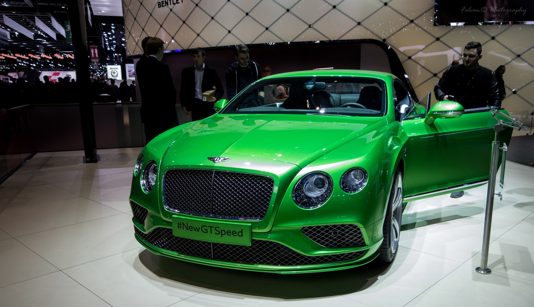 Green luxury coupe with mesh grille and round headlights