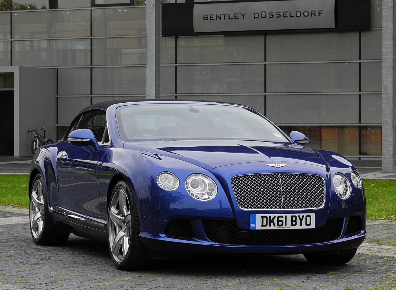 Blue convertible with mesh grille and round headlights front view