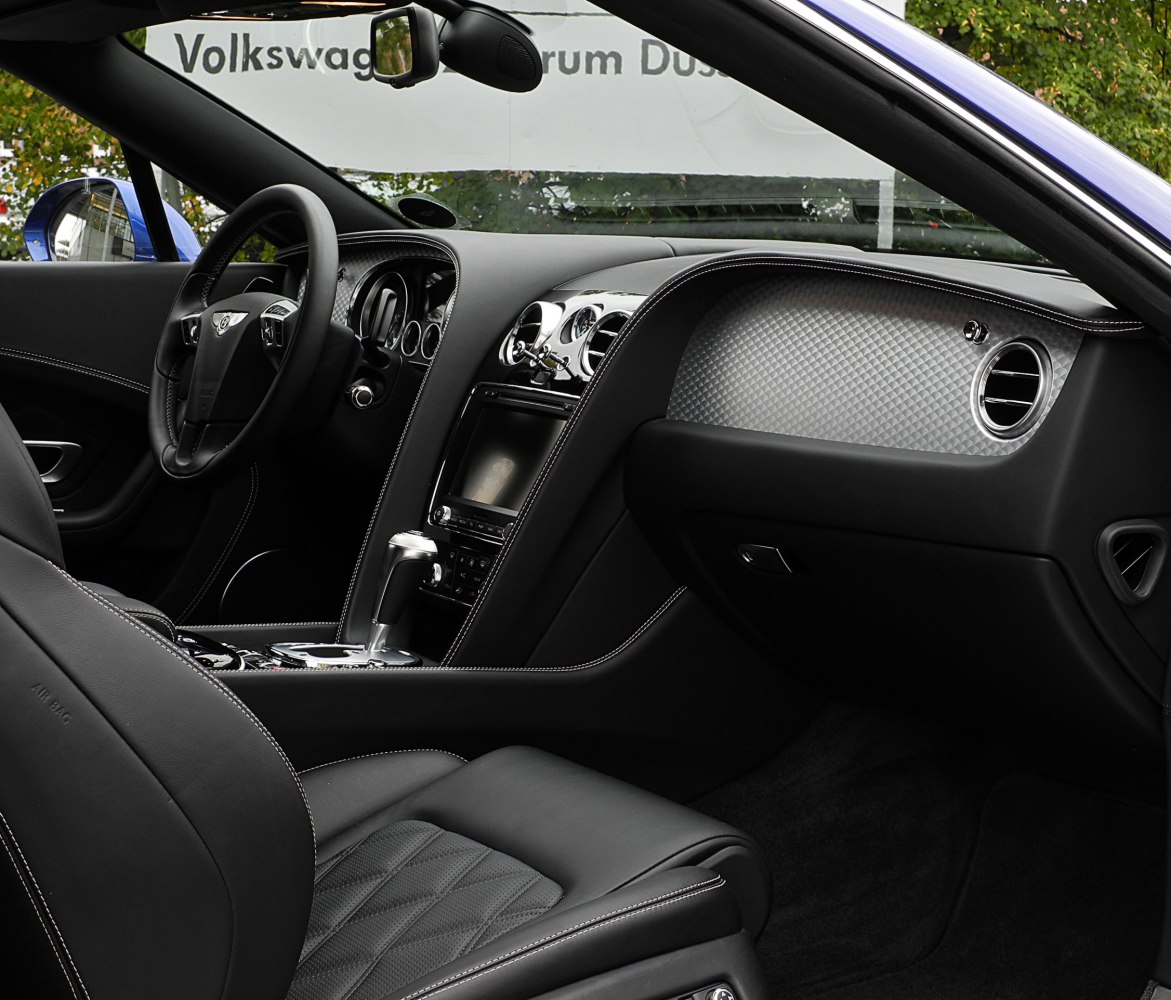Black leather interior with diamond quilting and carbon fiber trim