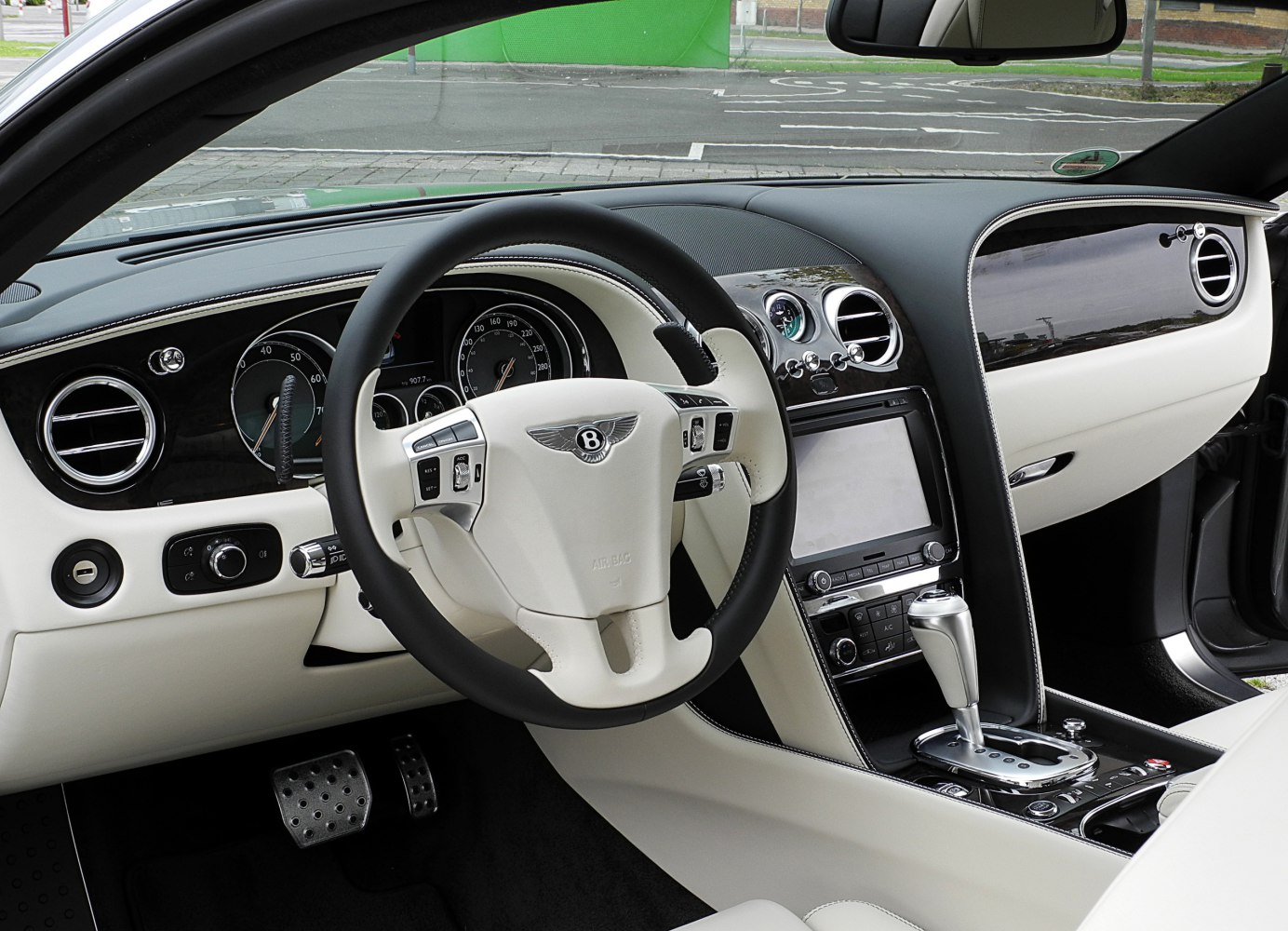 Luxury car interior with sophisticated dashboard and steering wheel