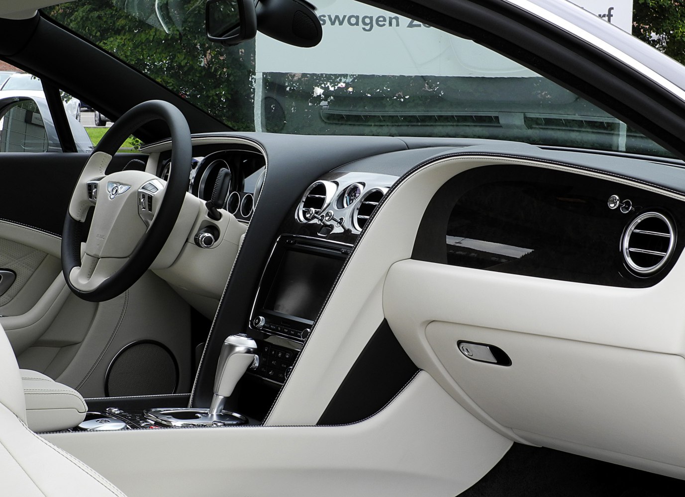 Beige and black leather interior with dashboard and gear lever