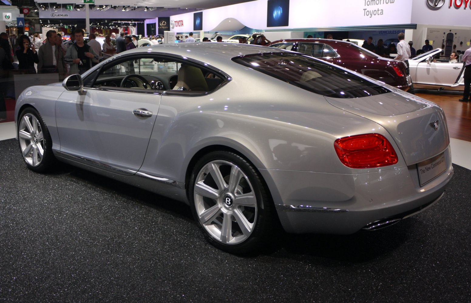 Silver luxury coupe with rear design and alloy wheels