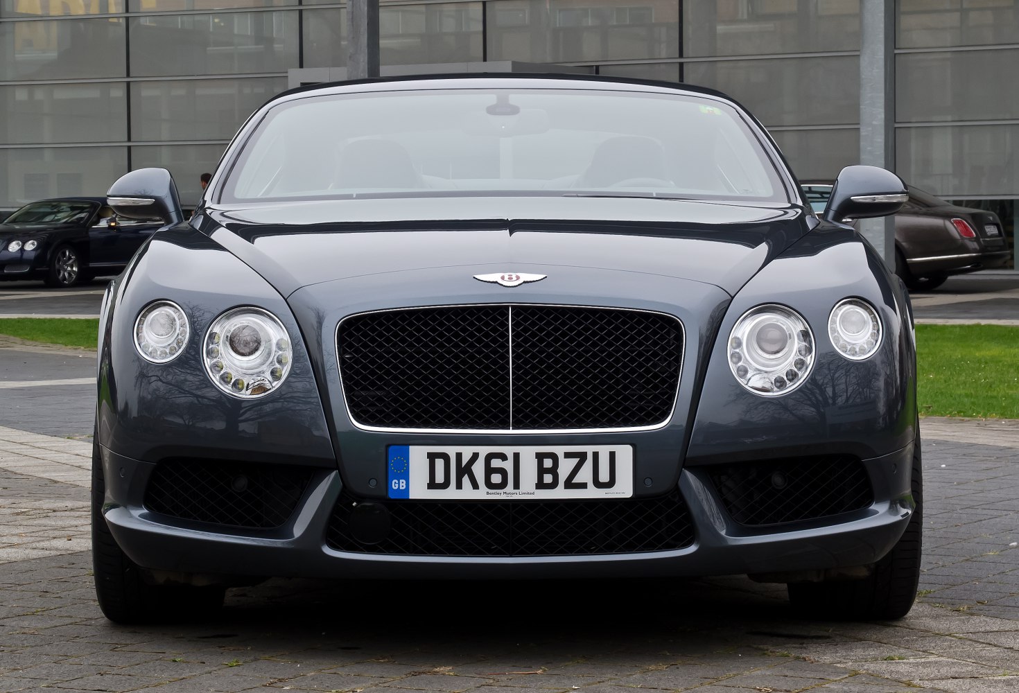 Front view with prominent grille and dual rounded headlights