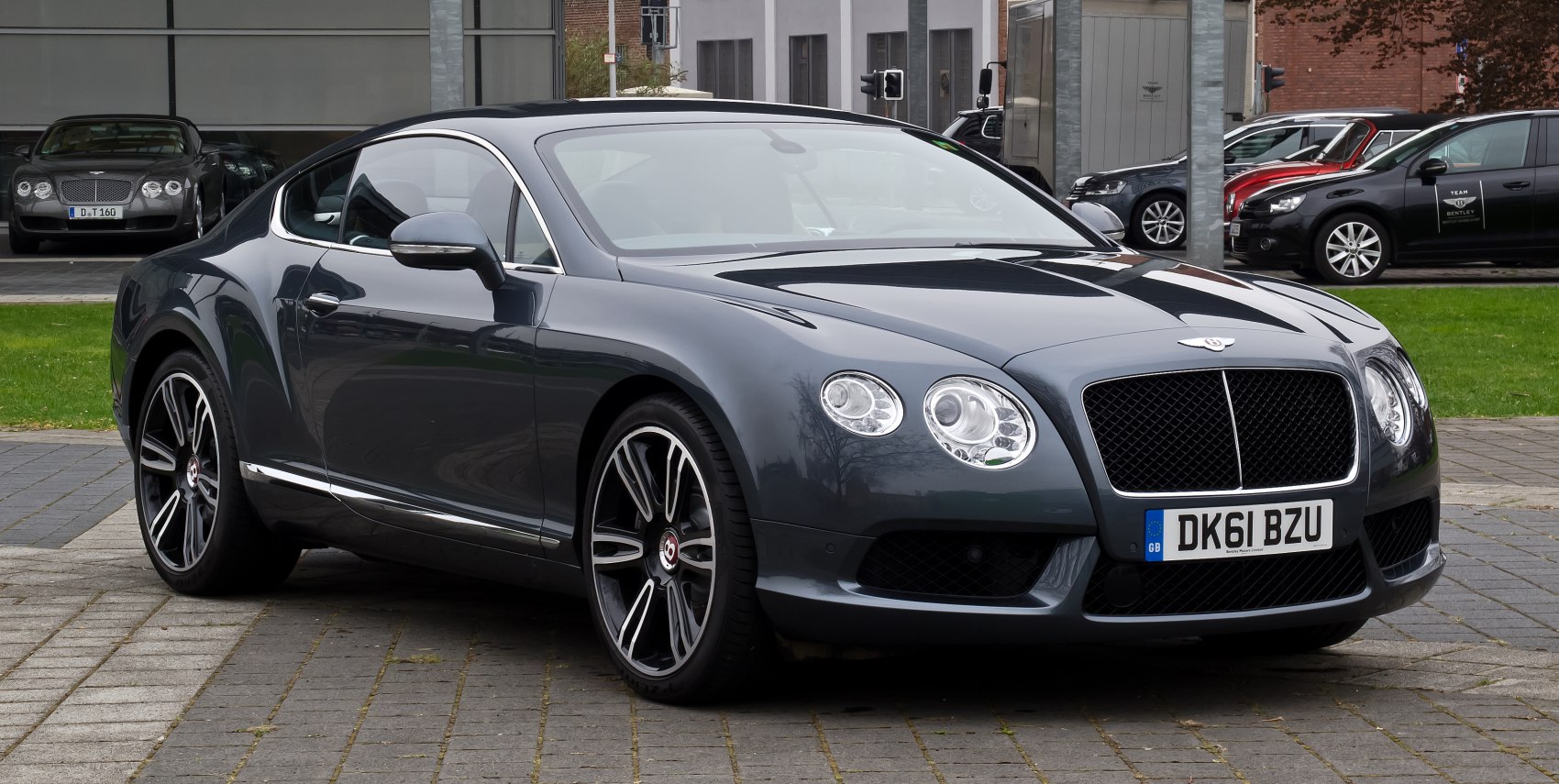 Sleek luxury coupe with dual circular headlights and premium alloy wheels
