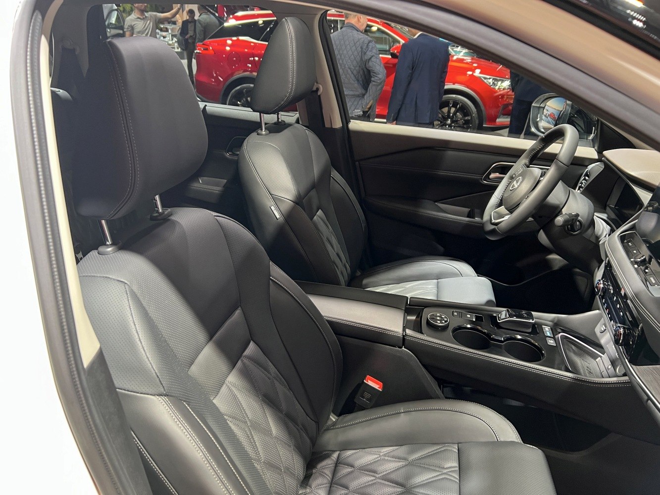 Premium black leather seats and modern center console with controls