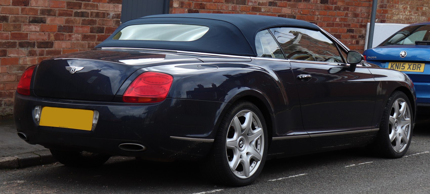 Rear view of convertible with soft-top and distinctive taillights