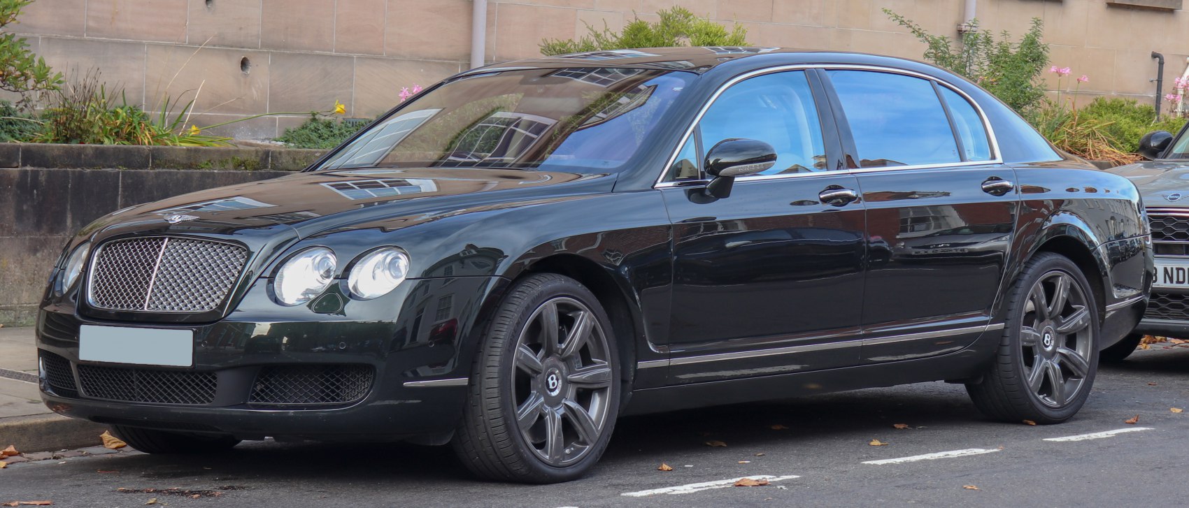 Luxury sedan with prominent front grille and alloy wheels