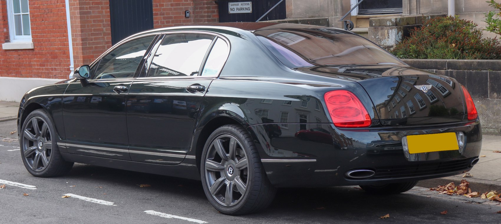 Rear side view with distinct tail lights and alloy wheels