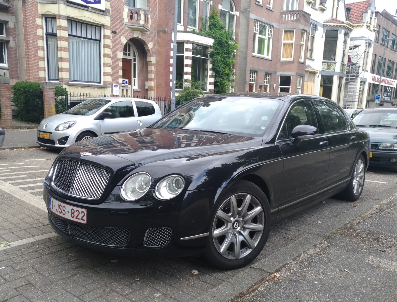 Luxury sedan with distinctive mesh grille and dual round headlights