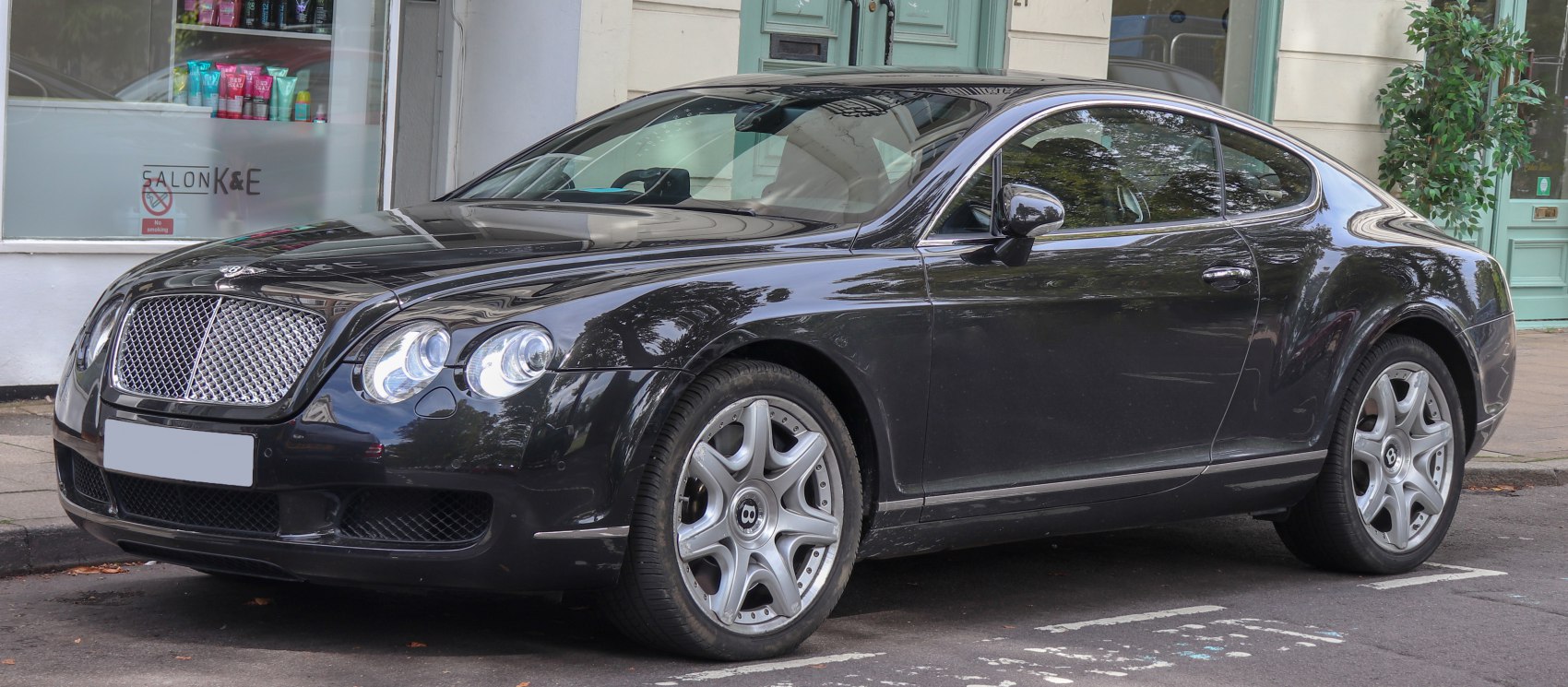 Luxury coupe with round headlights and alloy wheels