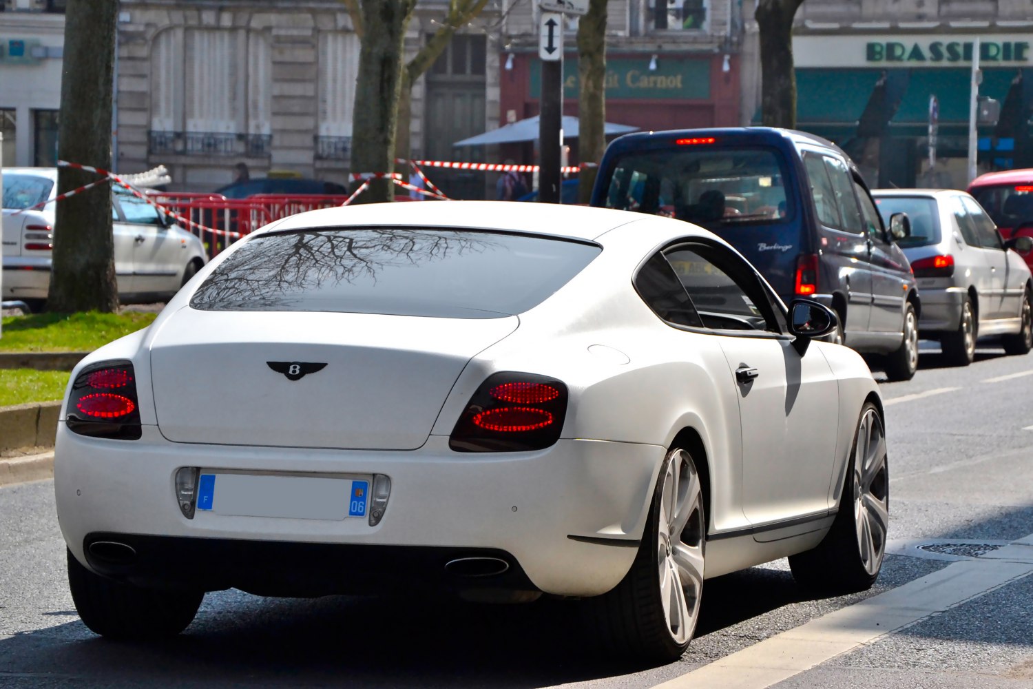 White luxury coupe rear with oval LED taillights and sleek aerodynamic shape