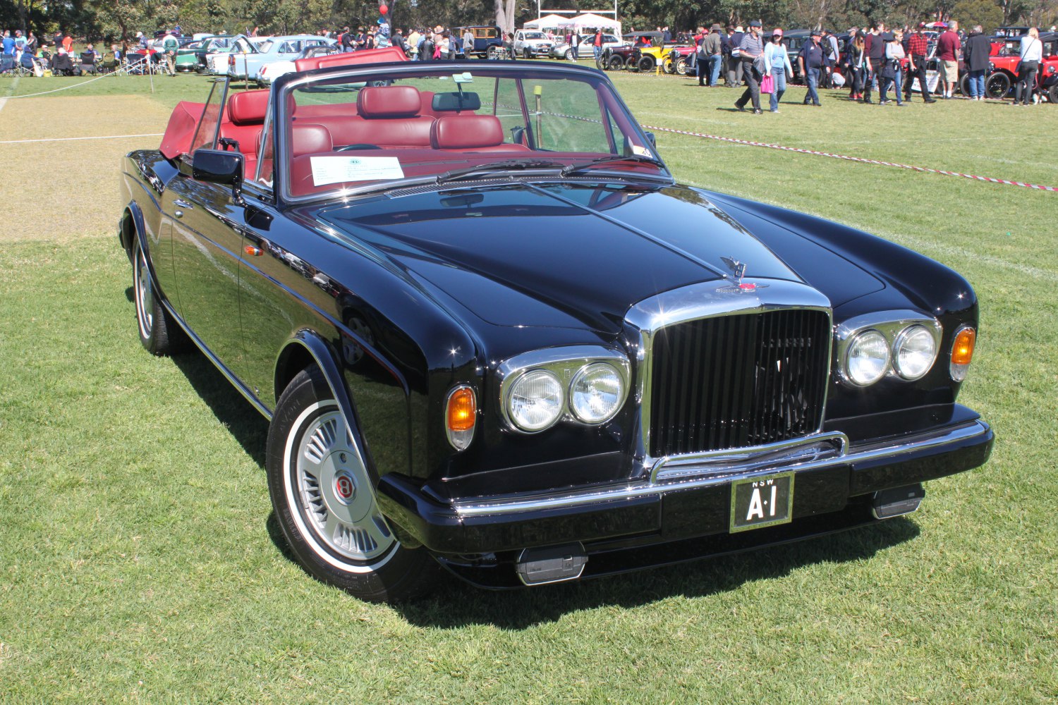 Vintage convertible showing elegant front grille and dual round headlights
