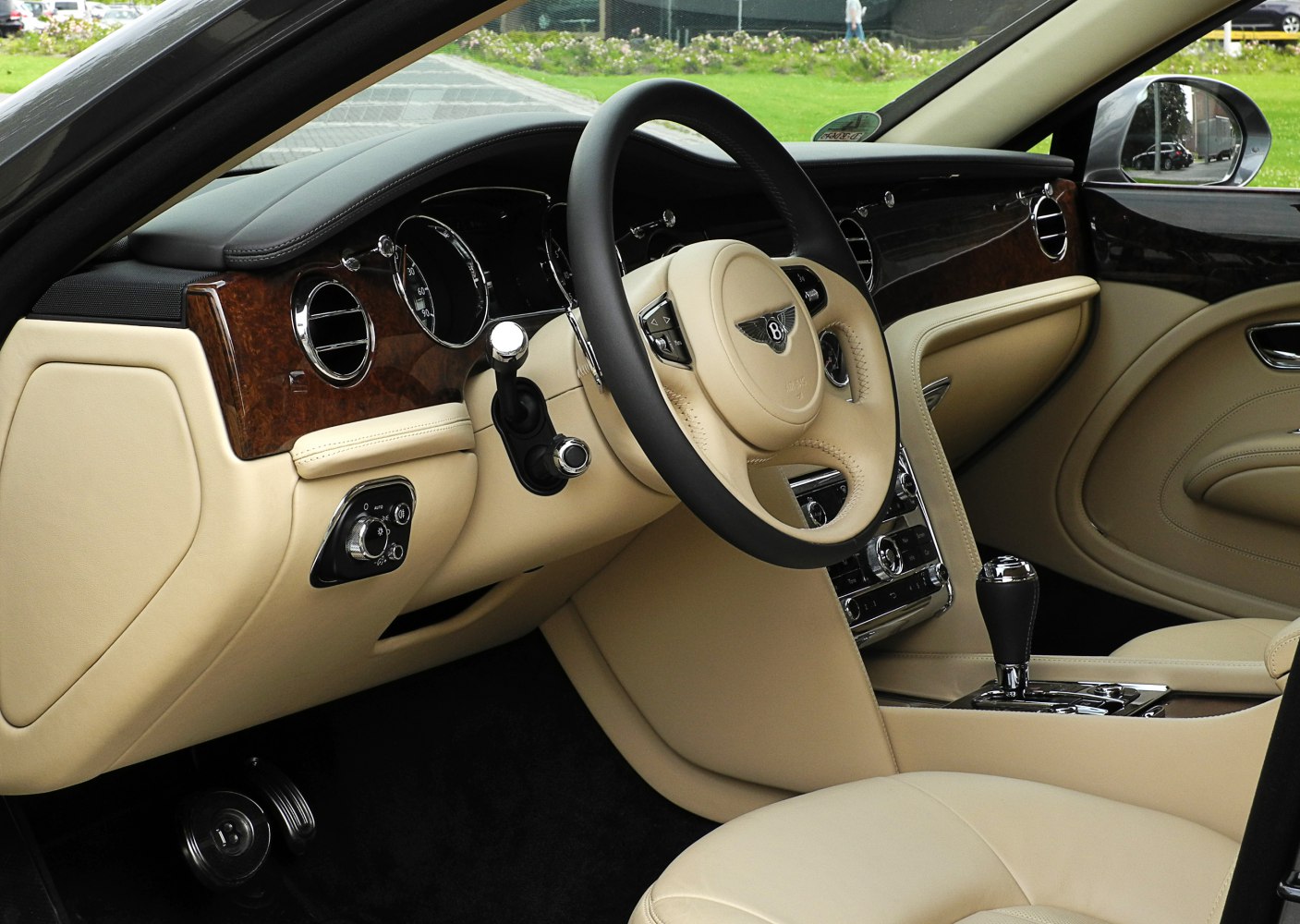 Beige leather interior with wood trim and chrome accents