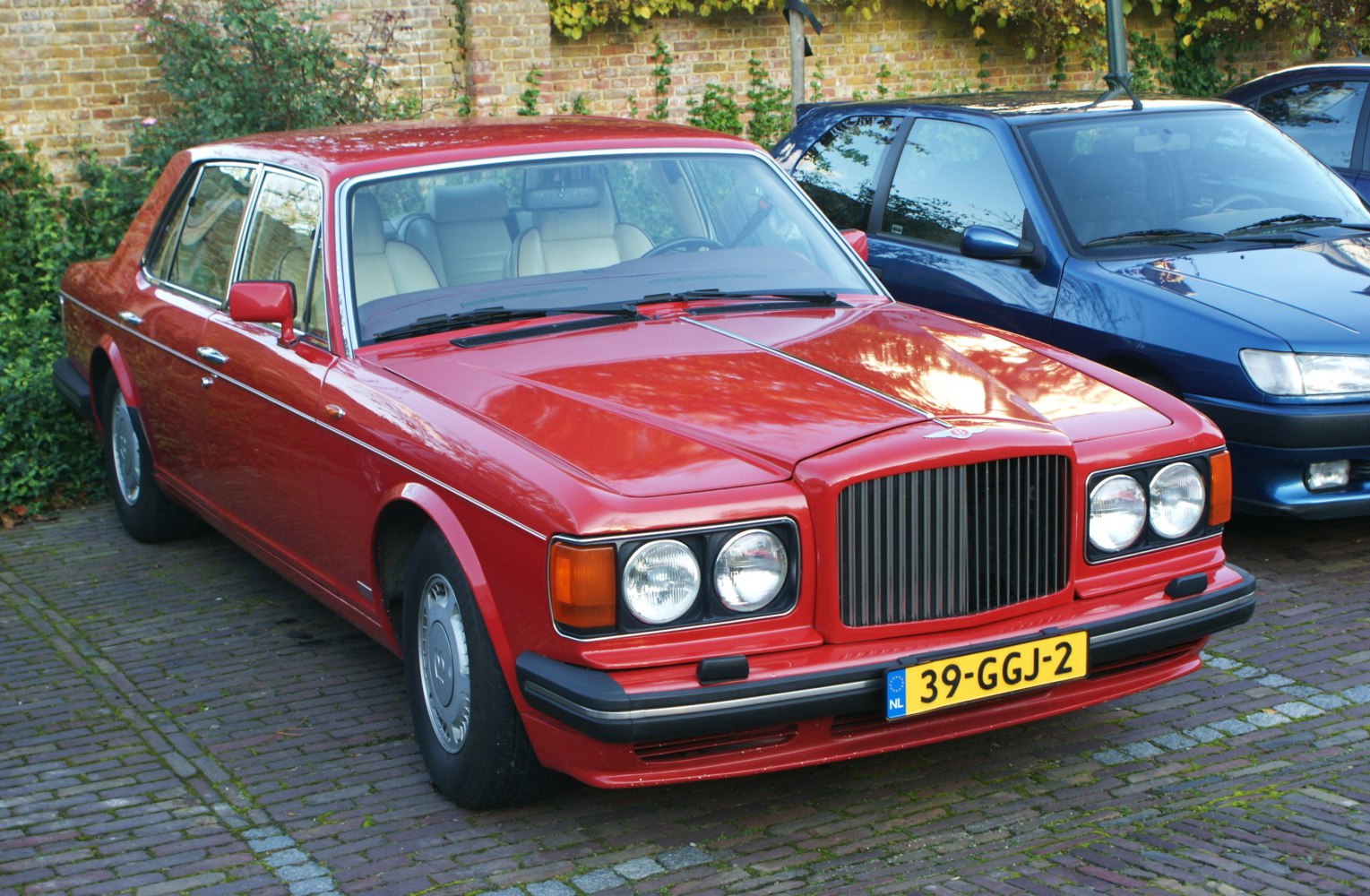 Classic sedan with quad headlights and vertical grille