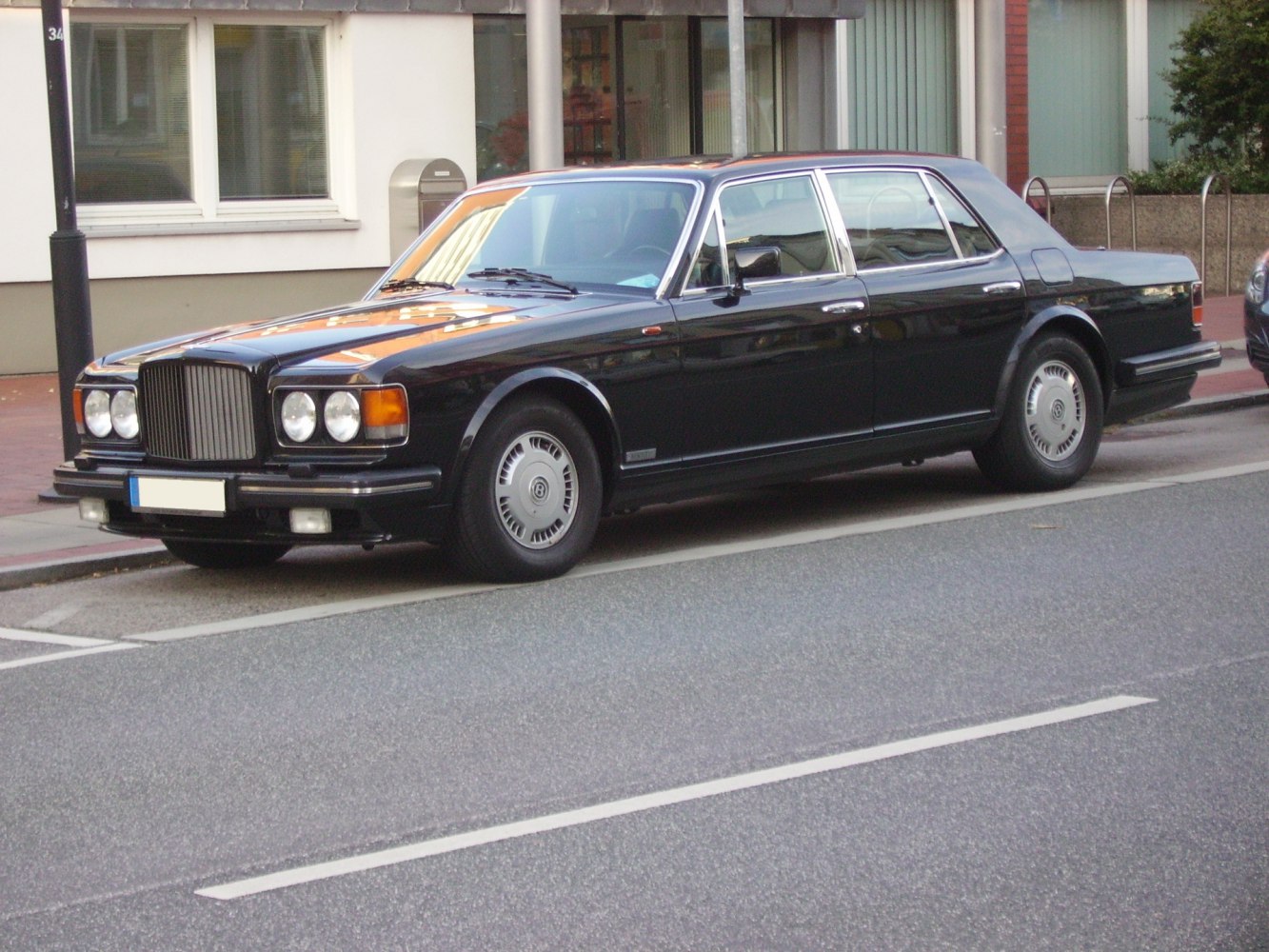 Luxury sedan with quad round headlights and chrome trims