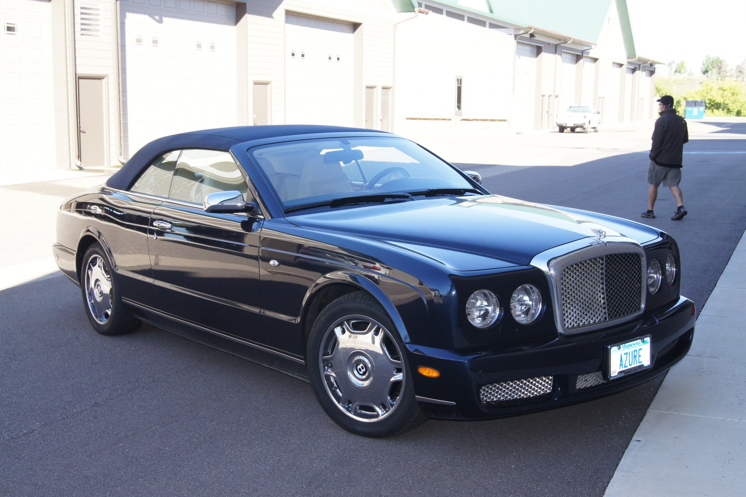 Luxury convertible with chrome grille and dual round headlights