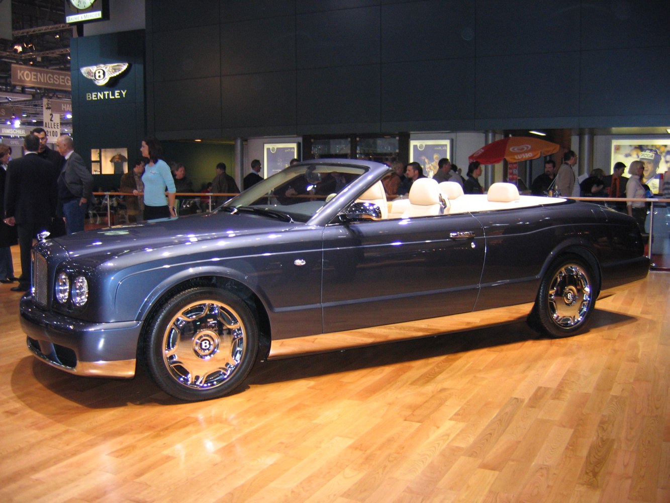 Luxury convertible with chrome wheels and beige leather seats