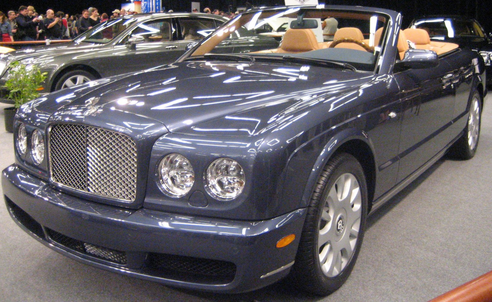 Luxury convertible with mesh grille and round headlights