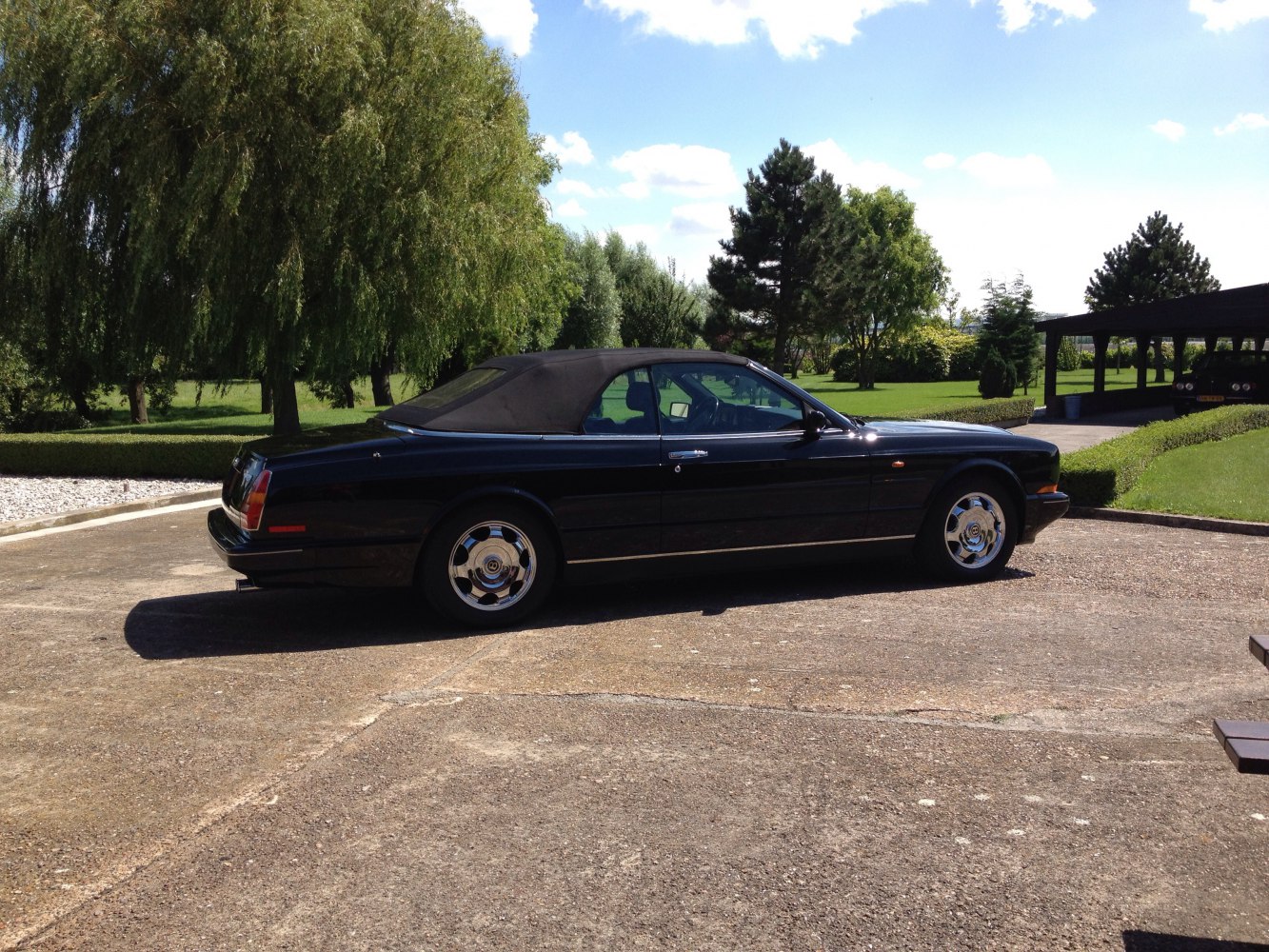 Convertible with sleek side profile and classic chrome wheels