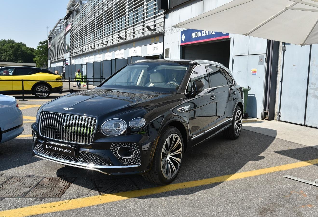 Luxury SUV with vertical-bar grille and multi-spoke alloy wheels in black