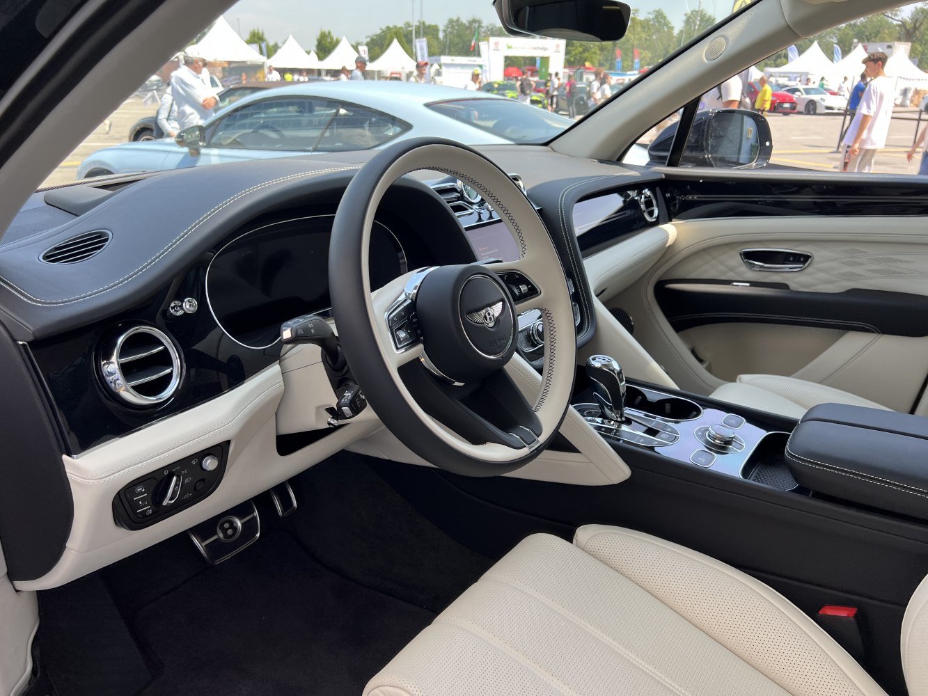 Luxury car interior with detailed steering wheel and premium controls