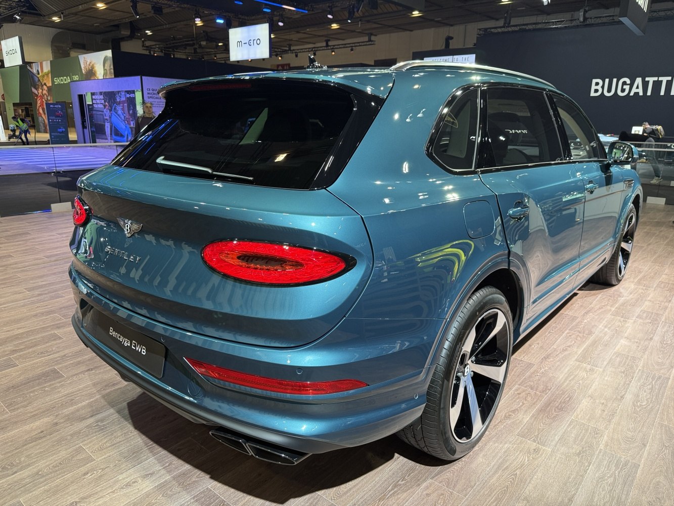 Rear view of luxury SUV with oval tail lights and large alloy wheels