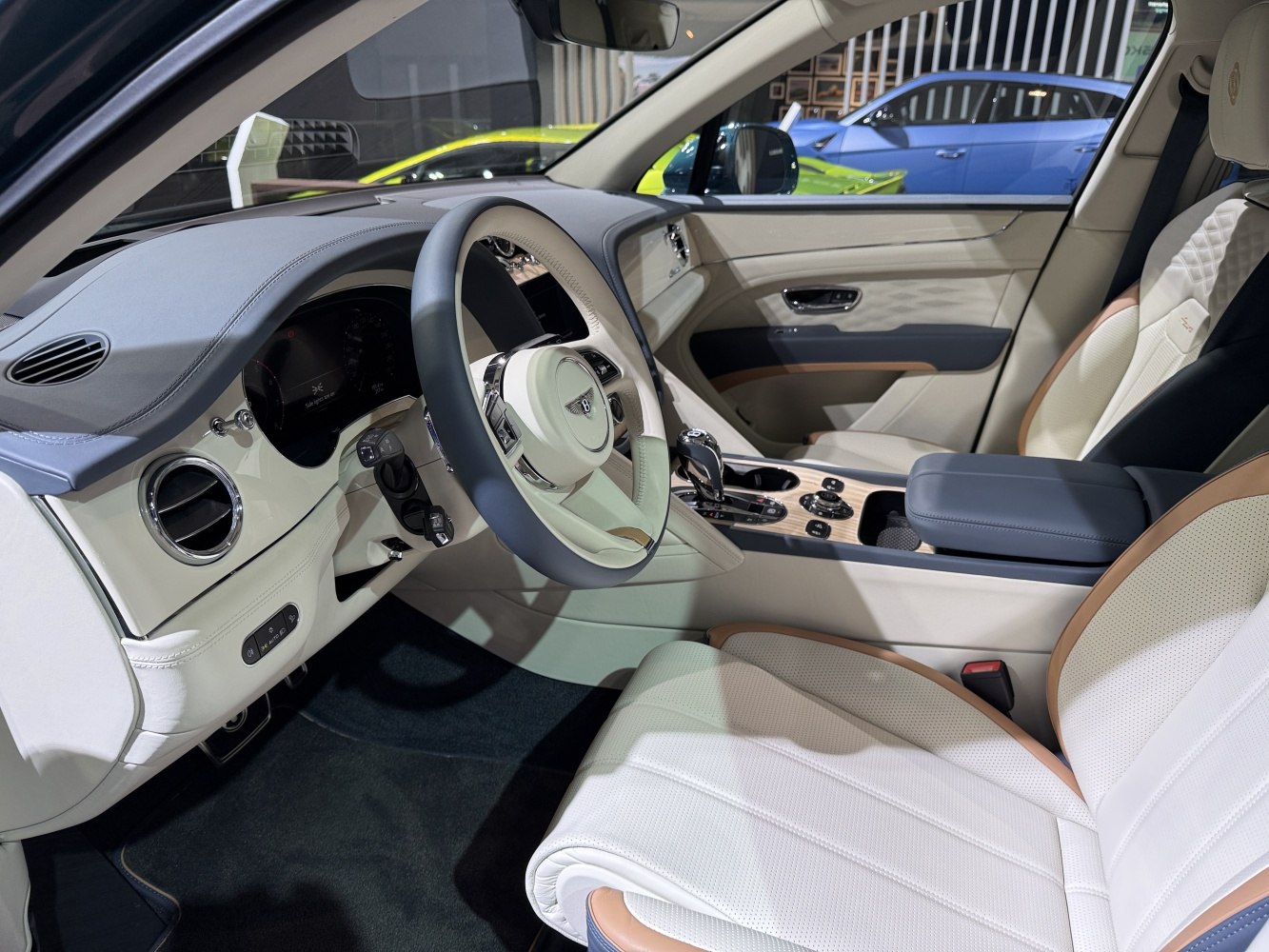 Beige leather seats and advanced dashboard with wood trim center console
