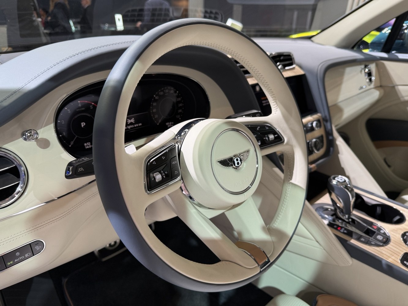 Luxury steering wheel and digital instrument cluster with beige leather interior