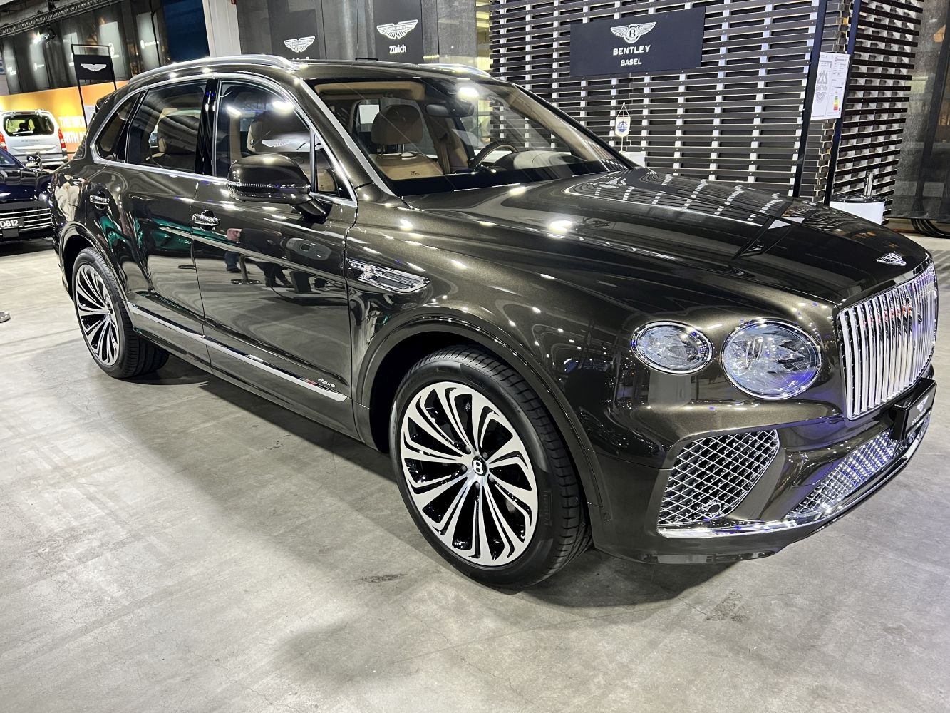 Luxury SUV with prominent chrome grille and distinctive alloy wheels