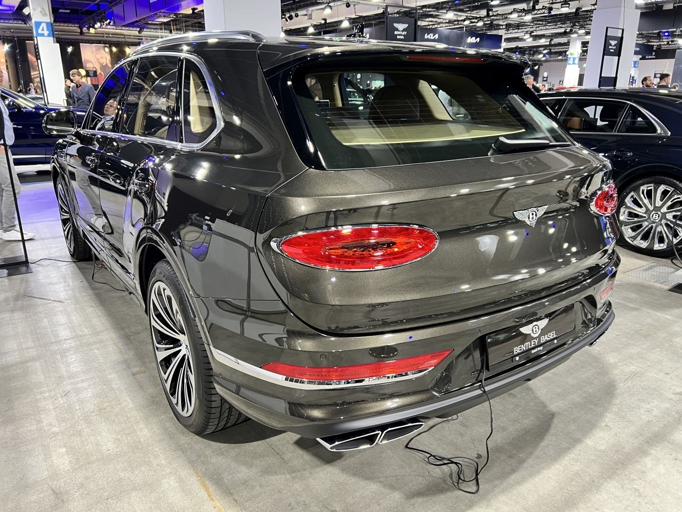 Luxury SUV rear with oval tail lights and dual exhaust
