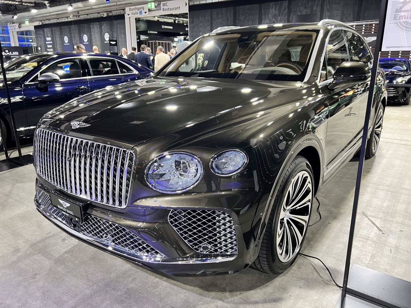 Luxury SUV with bold vertical grille and prominent round headlights