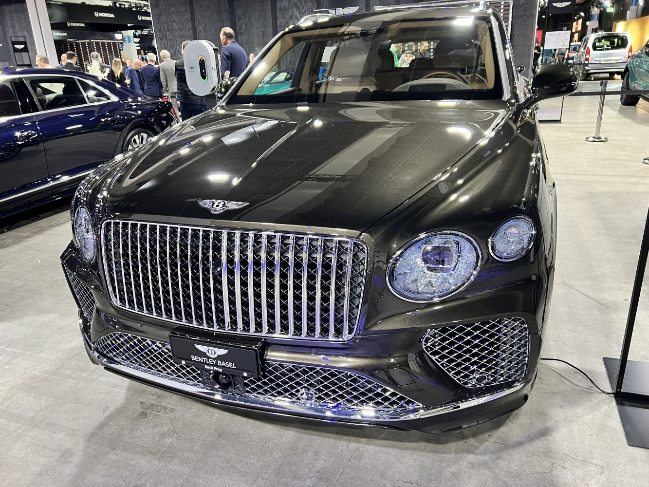 Distinctive luxury front grille and round headlights of SUV