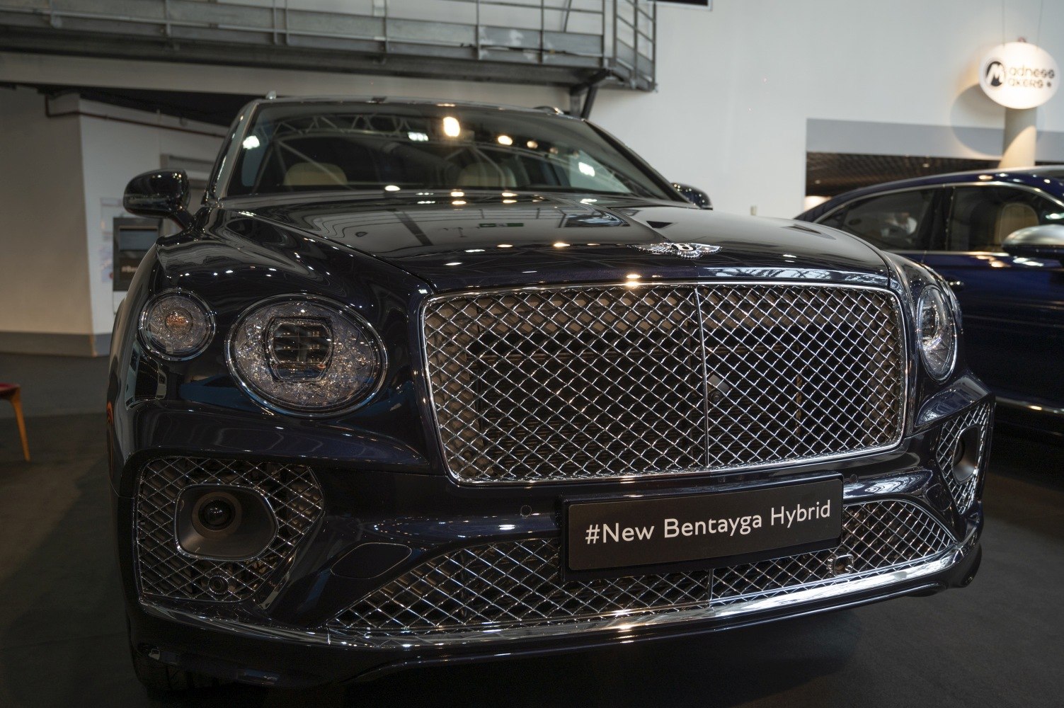 Bentley SUV front grille with LED headlights and chrome mesh design