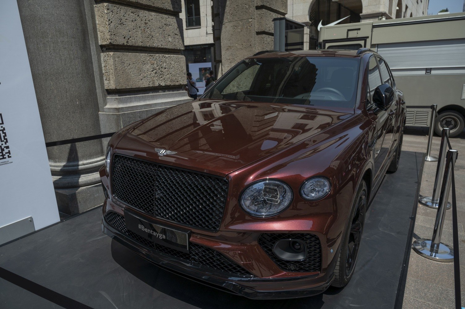 Luxury SUV front view with large mesh grille and round LED headlights