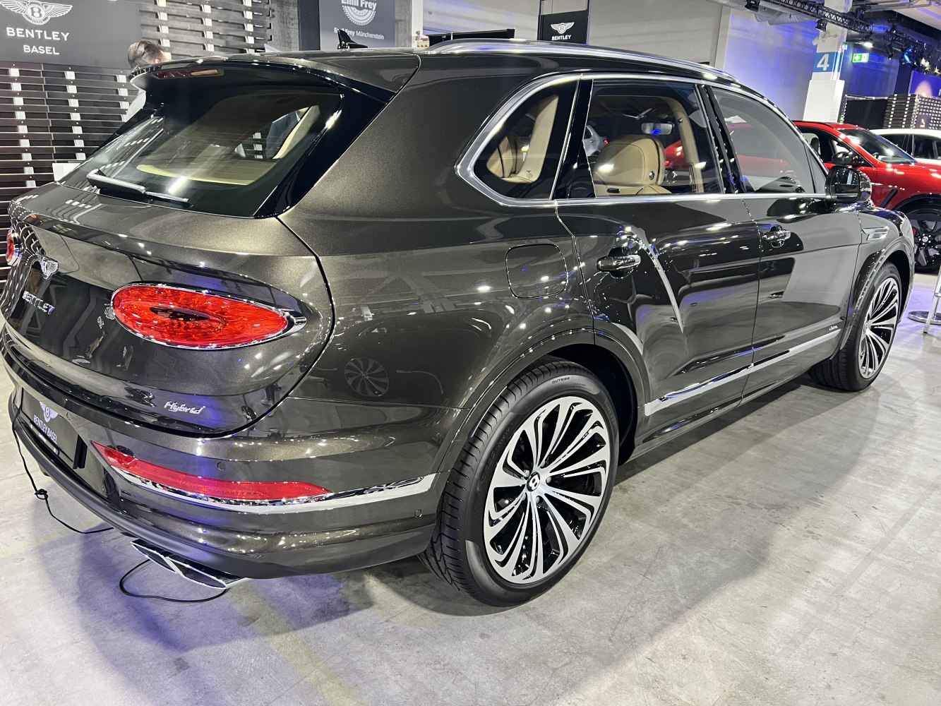 Rear and side view of a luxury SUV with distinctive taillights and alloy wheels