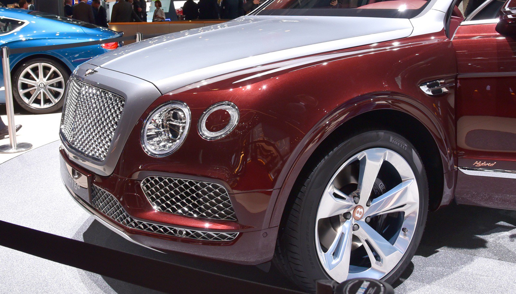 Front side view showing circular headlights and diamond mesh grille.