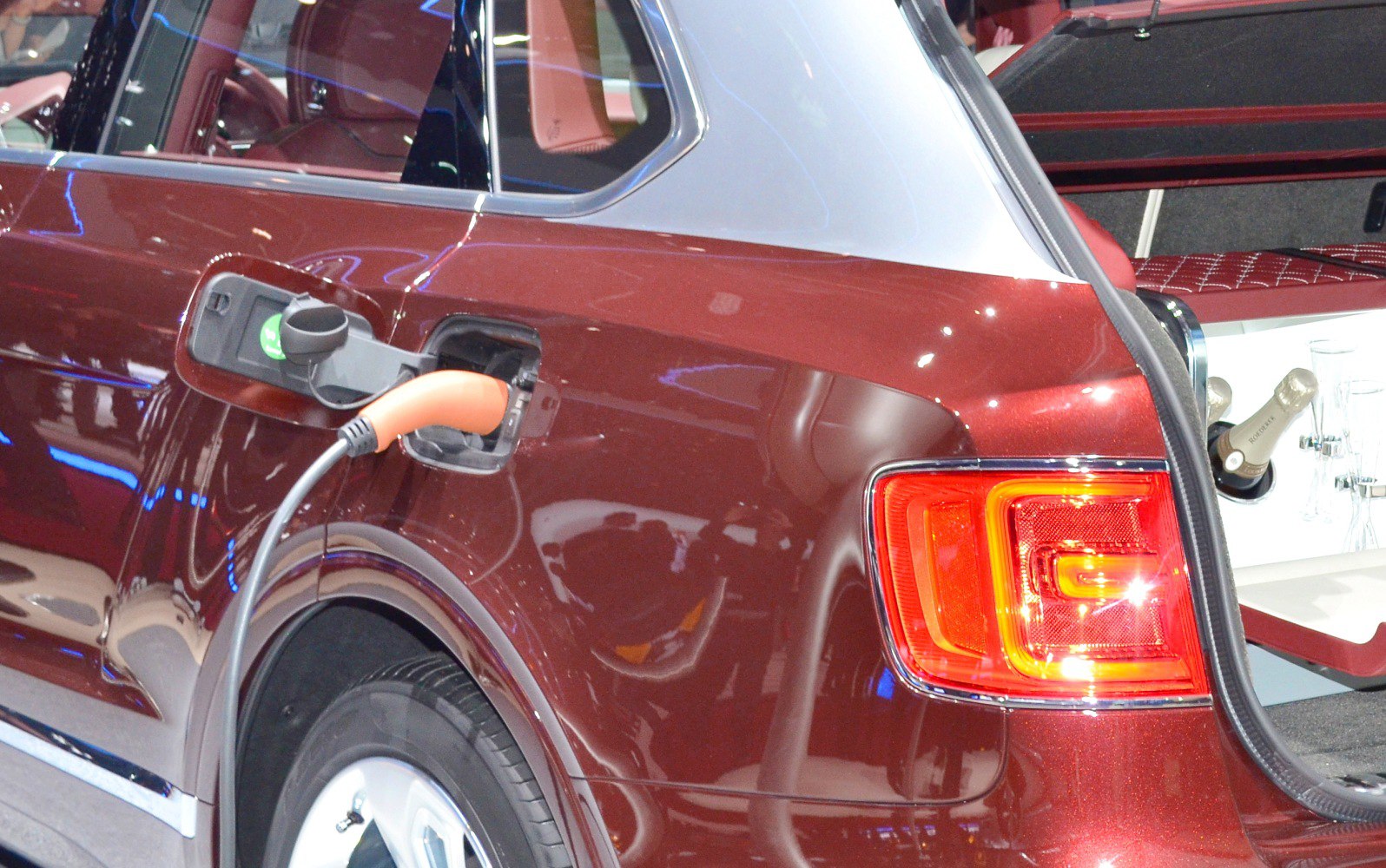 Plug-in hybrid charging port with open rear hatch and tail light