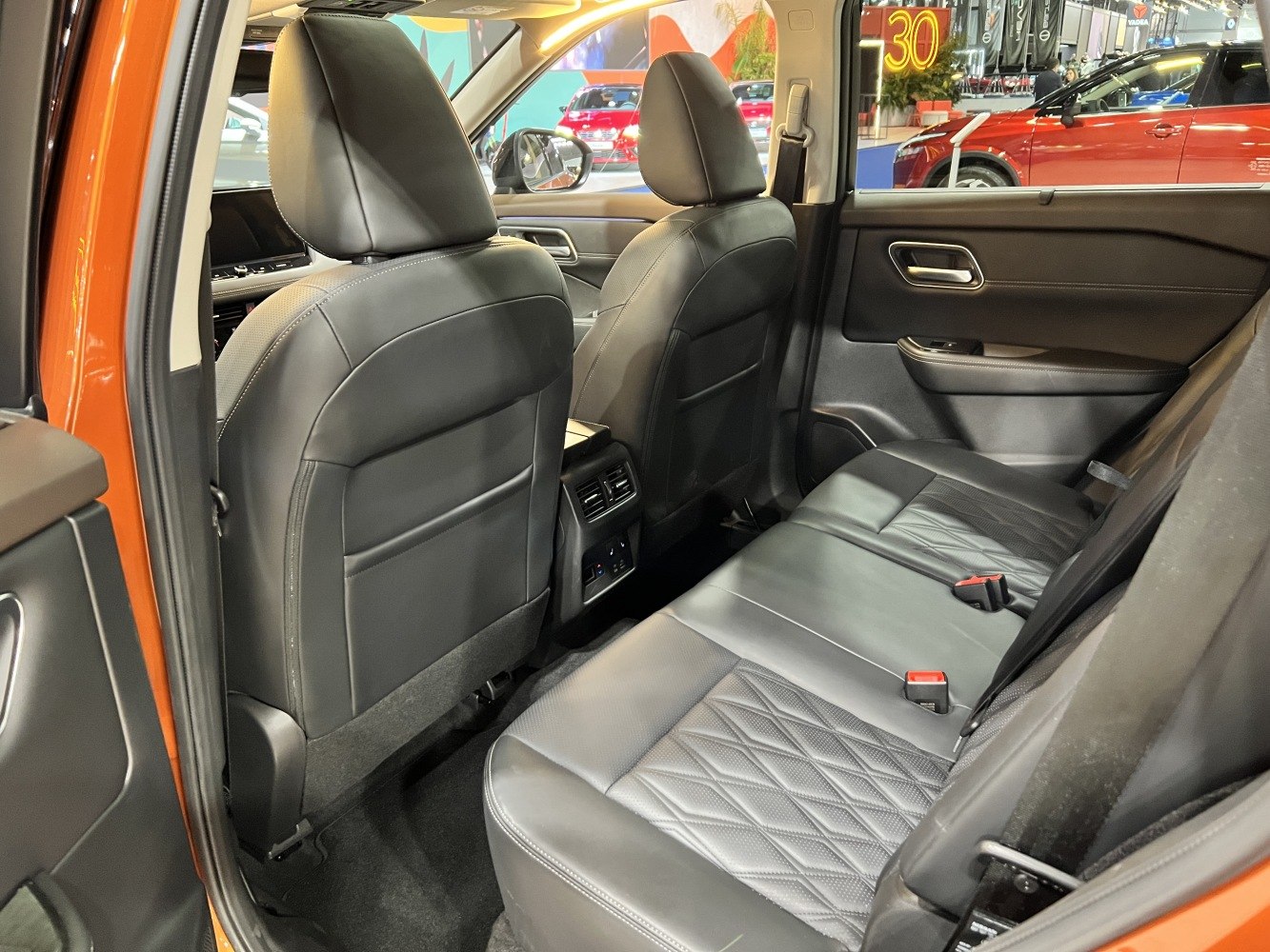 Leather rear seats with rear climate control vents in vehicle interior