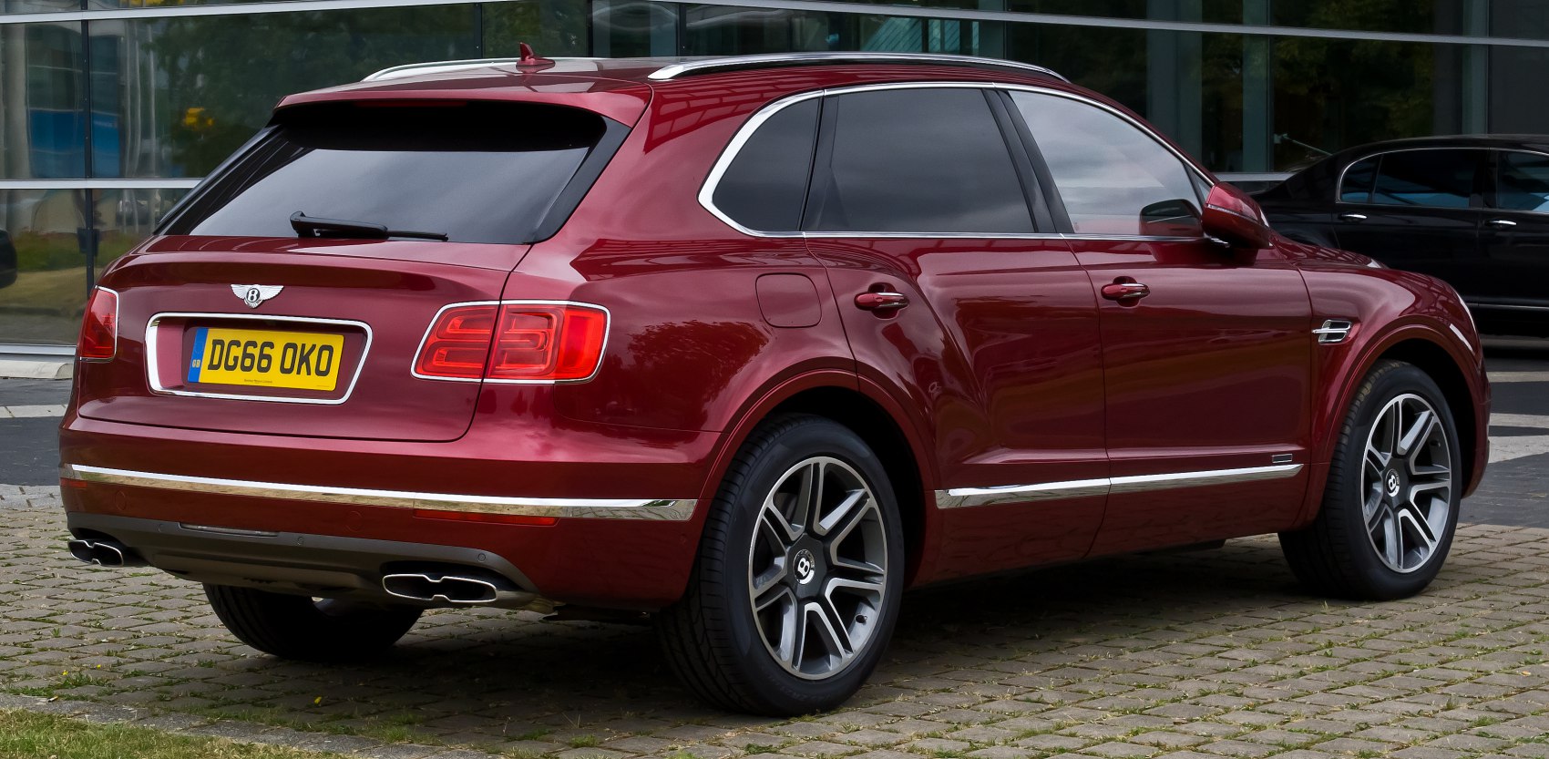 Luxury SUV rear side with distinctive taillights and chrome trim