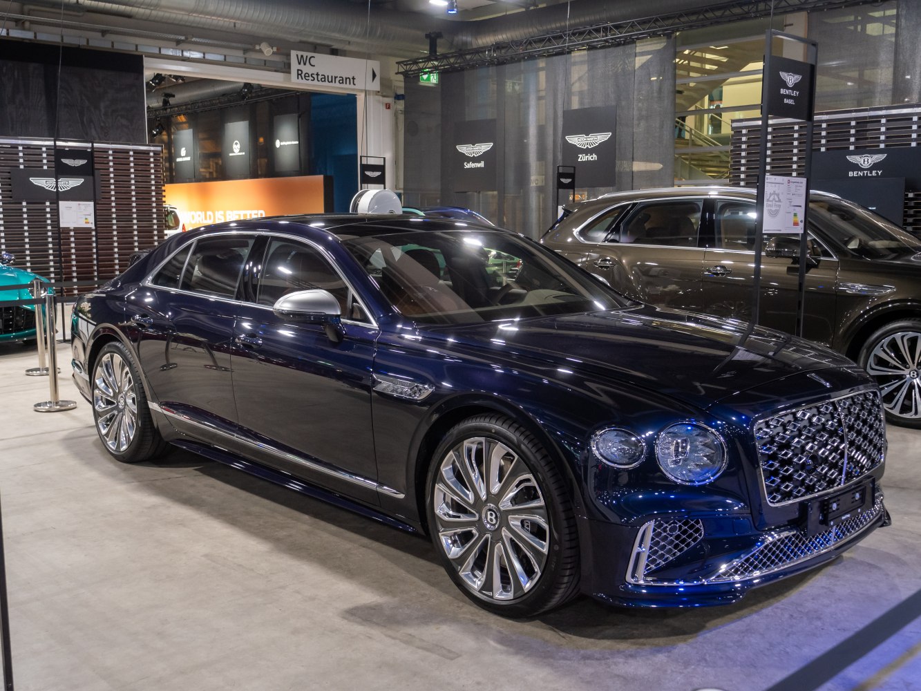 Luxury sedan with chrome grille and multi-spoke alloy wheels