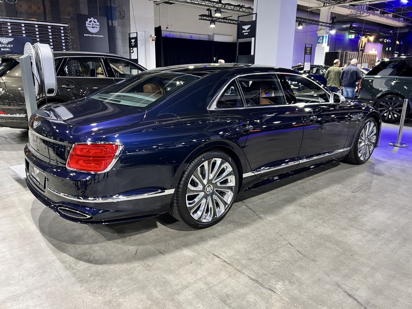Rear three-quarter view of luxury sedan with chrome trim and alloy wheels